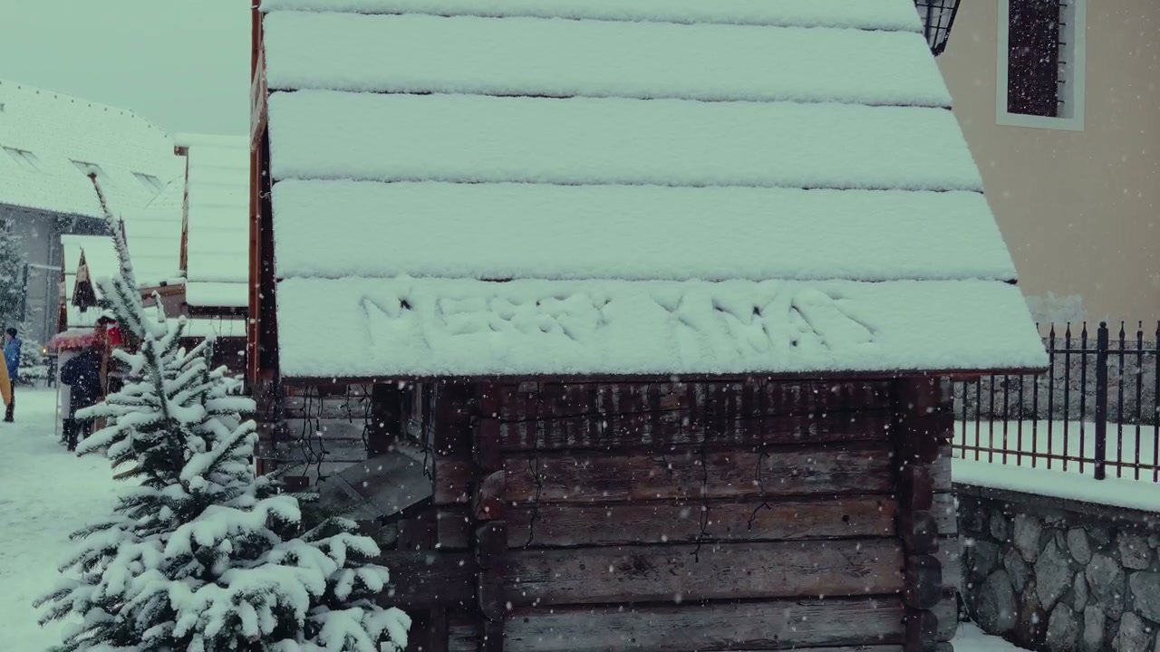 Merry Christmas Message on a Snowy Roof