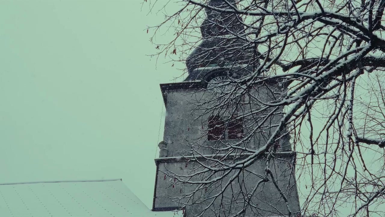 Snow Falling on Old Church Tower