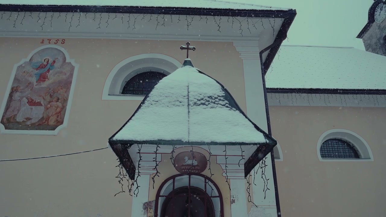 Snow Falling on Church Entrance
