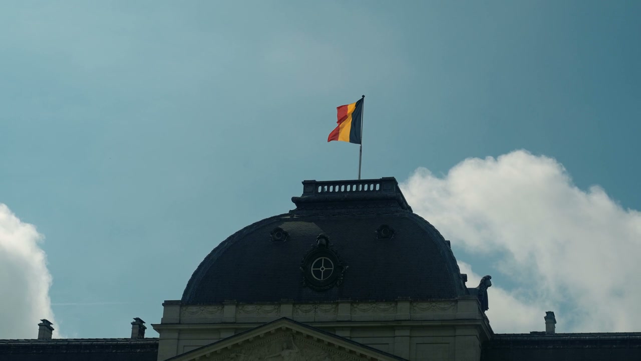 Belgian Flag Waving on Building in Brussels