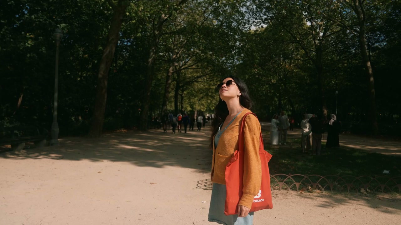 Young Woman Looking Up in Brussels Park