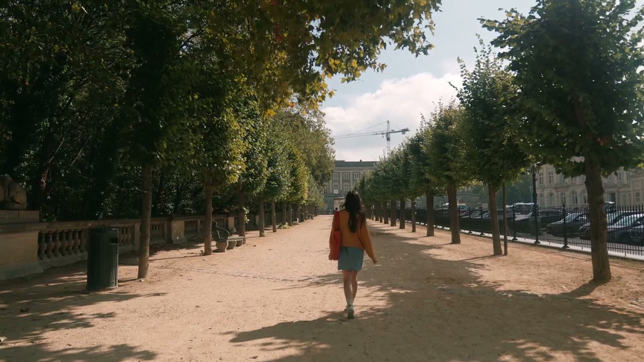 Woman Strolling Through Royal Park Brussels
