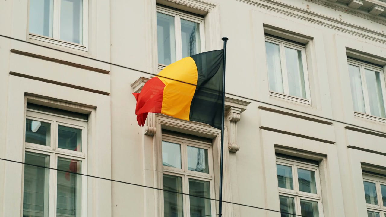 Belgian Flag Waving on Building in Brussels