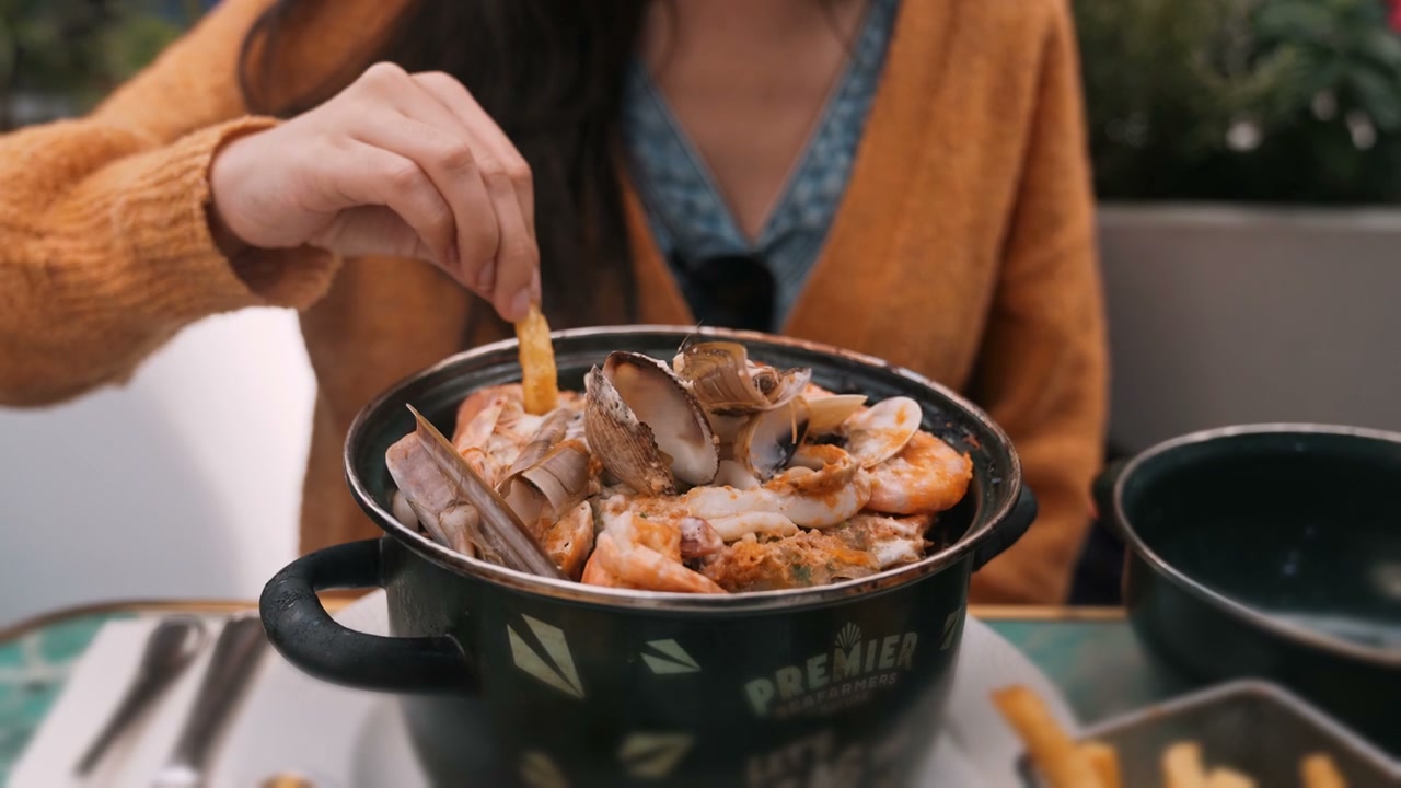 Person Eating Seafood in Brussels Restaurant