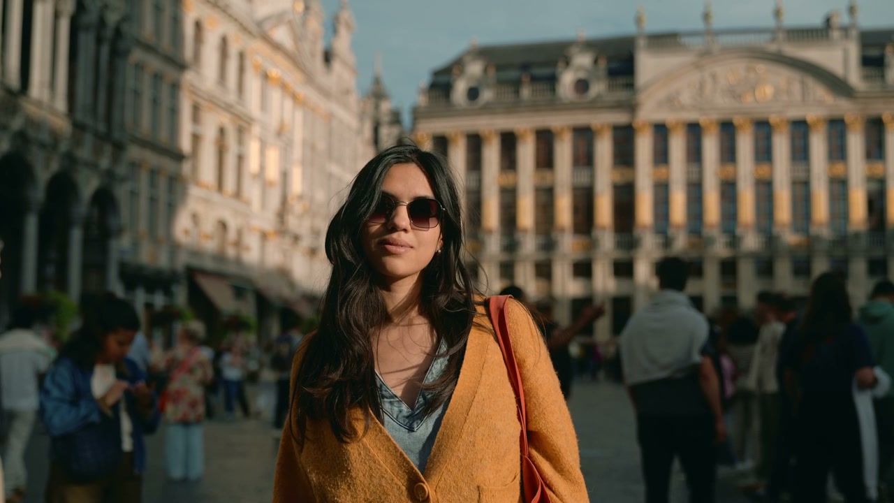 Young Woman Walking in Brussels Grand Place