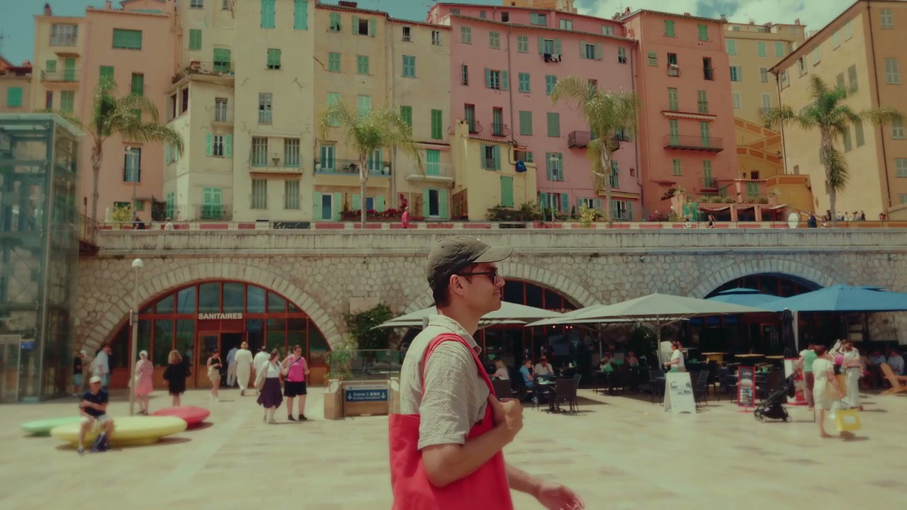 Man Walking on Menton Waterfront