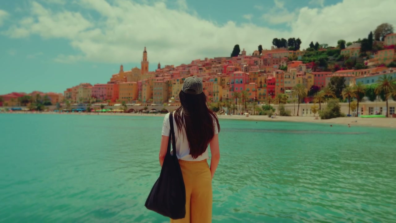 Woman Looking at Menton Coastal Town