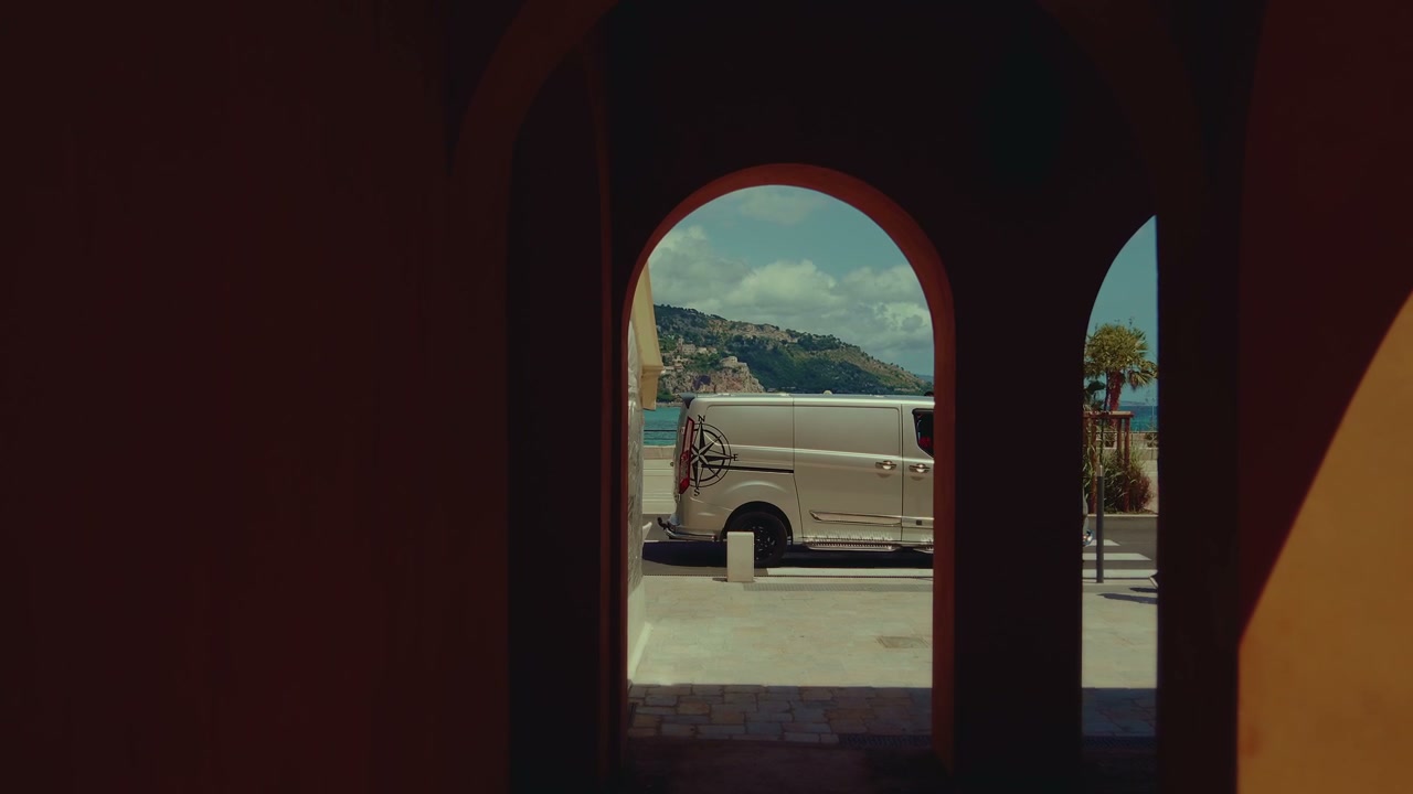 Coastal Town View Through Arches