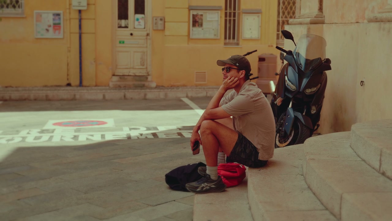 Man Resting on Steps in Menton Street