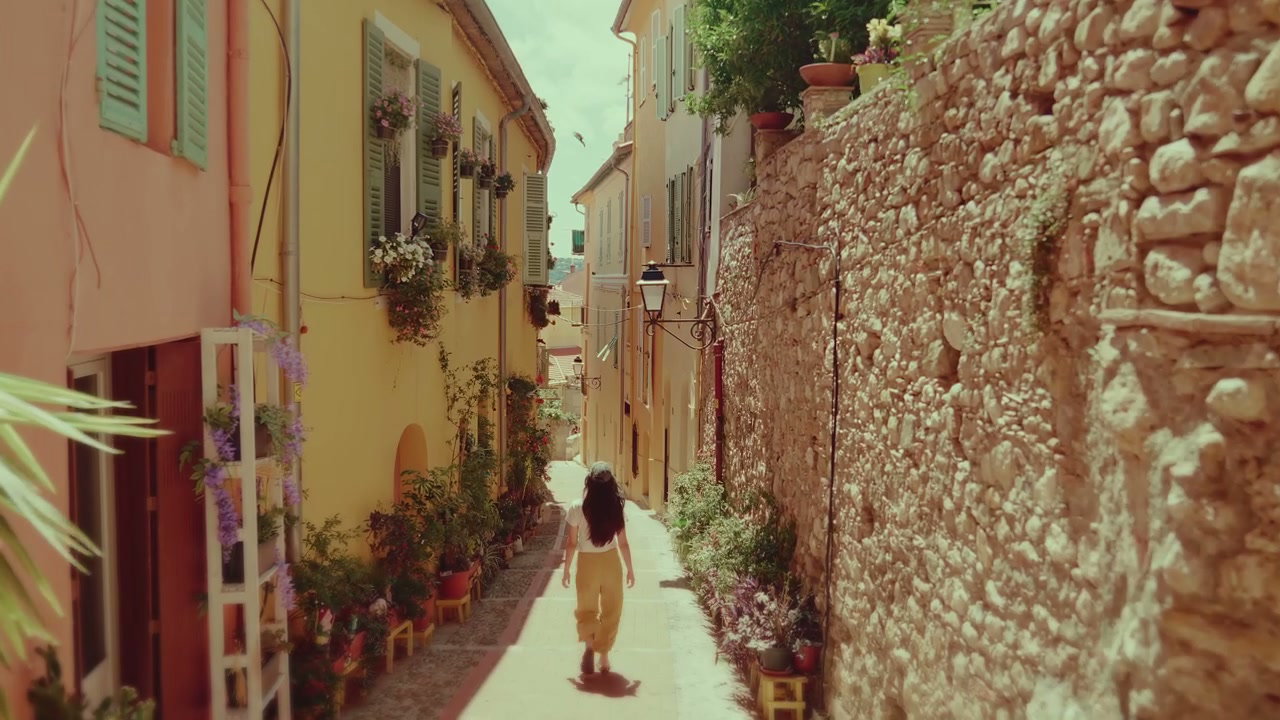 Woman Walking Down Narrow Menton Street