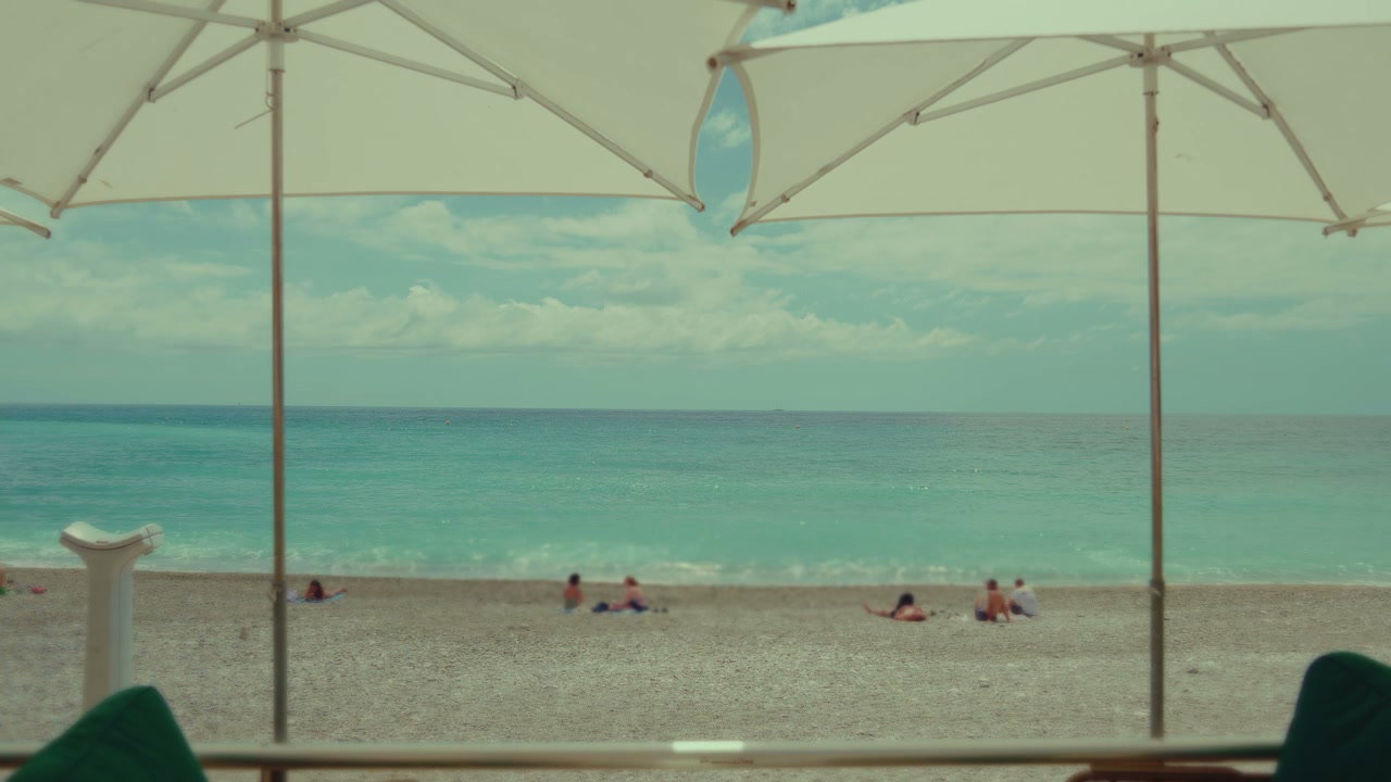 Menton Beach View with Umbrellas and Sea