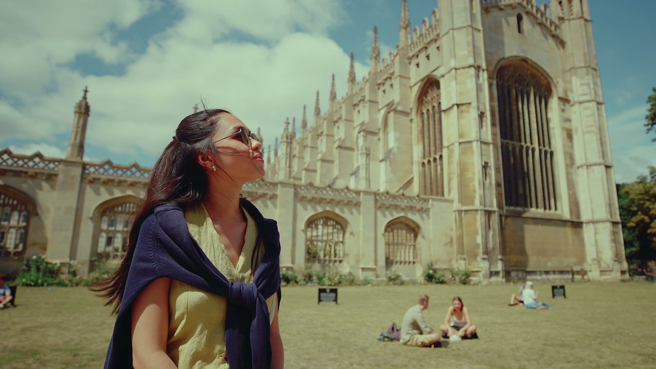 Young Woman Looking Up in Cambridge on a Summer Day