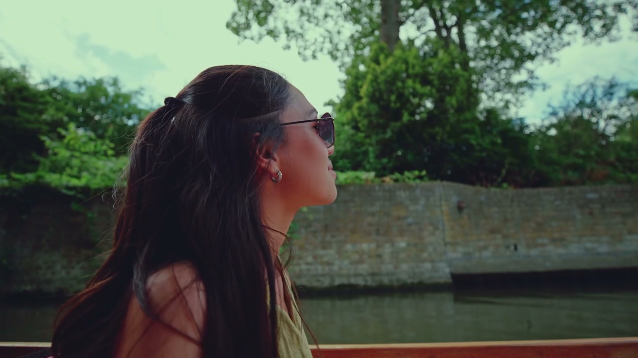 Young Woman Enjoying Punting Trip in Cambridge