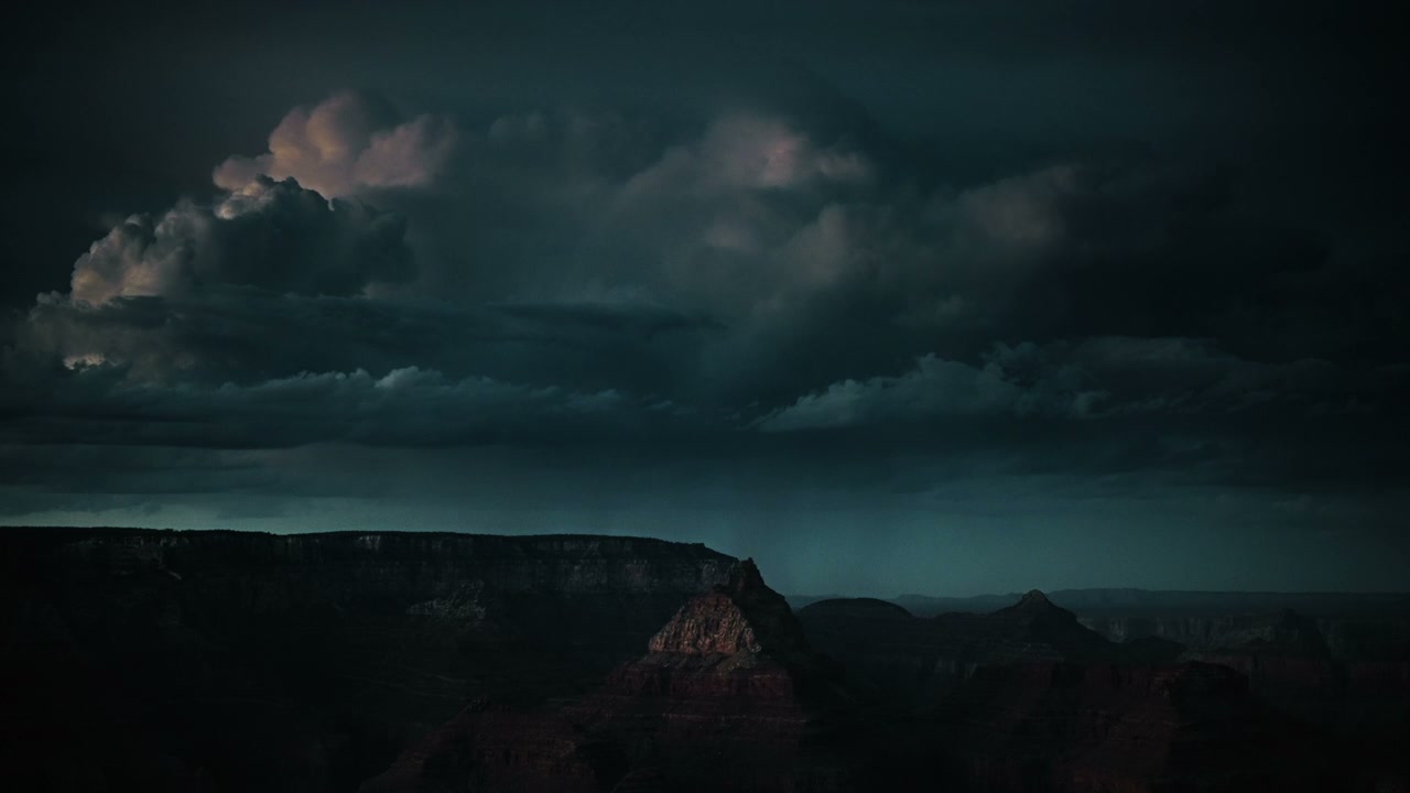 Dramatic Lightning Over Canyon Landscape