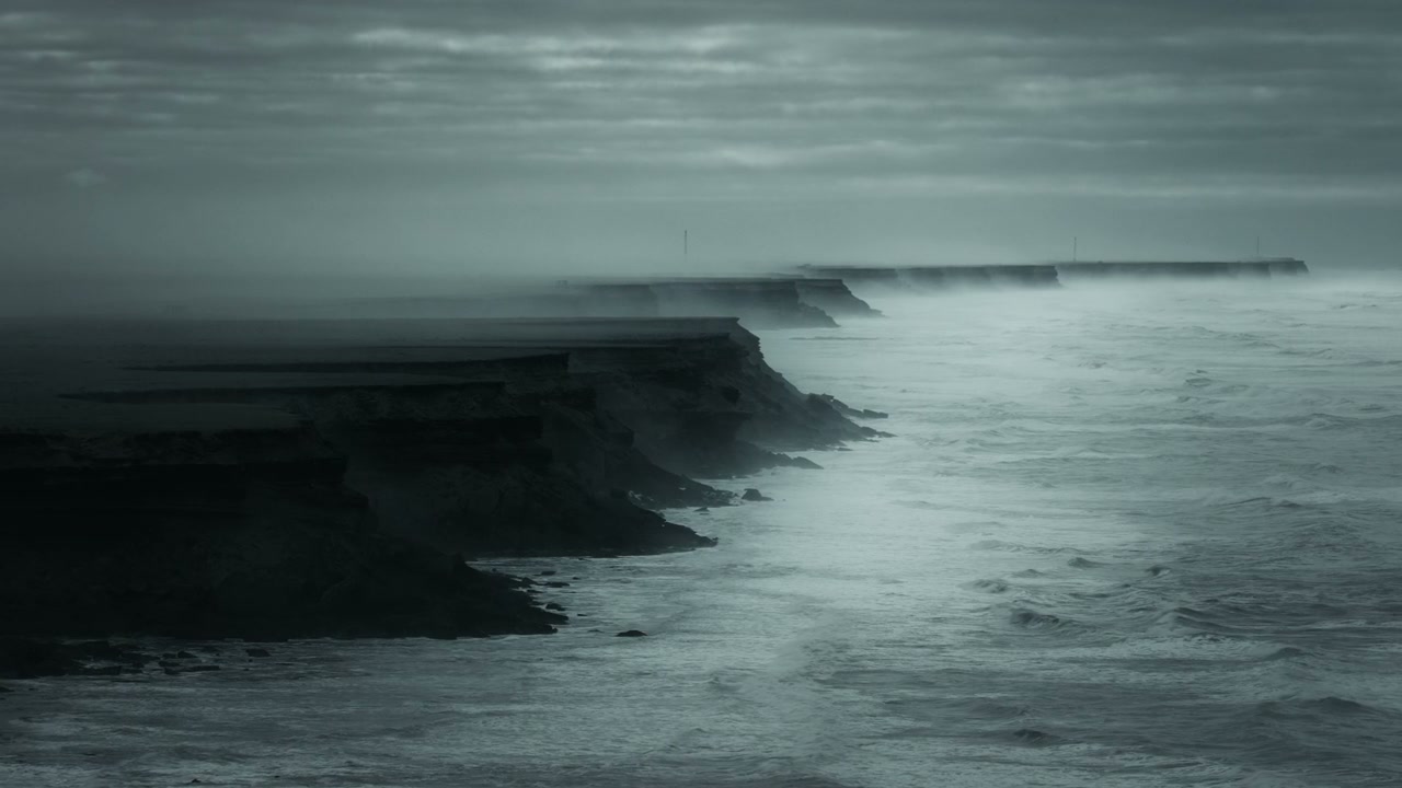 Misty Ocean Cliffs with Crashing Waves