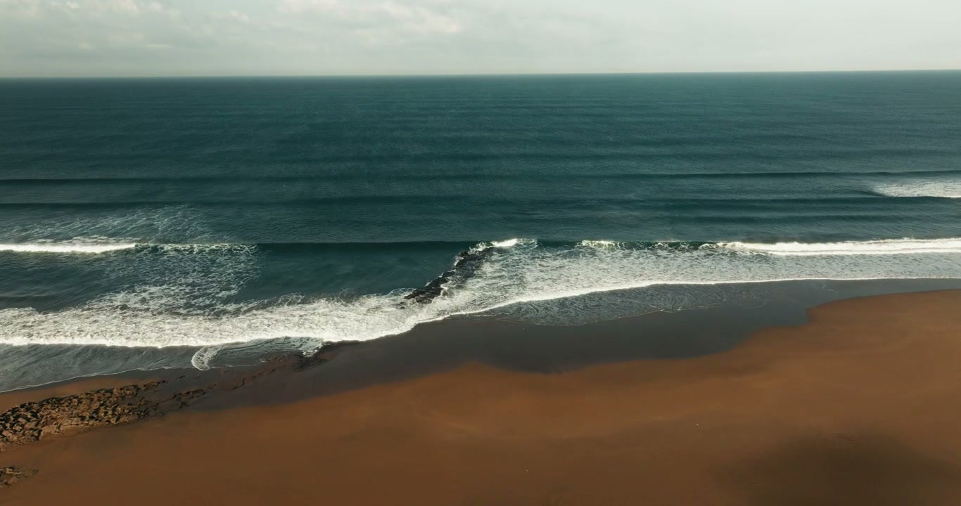 Ocean Waves Crashing on Morocco Sandy Beach