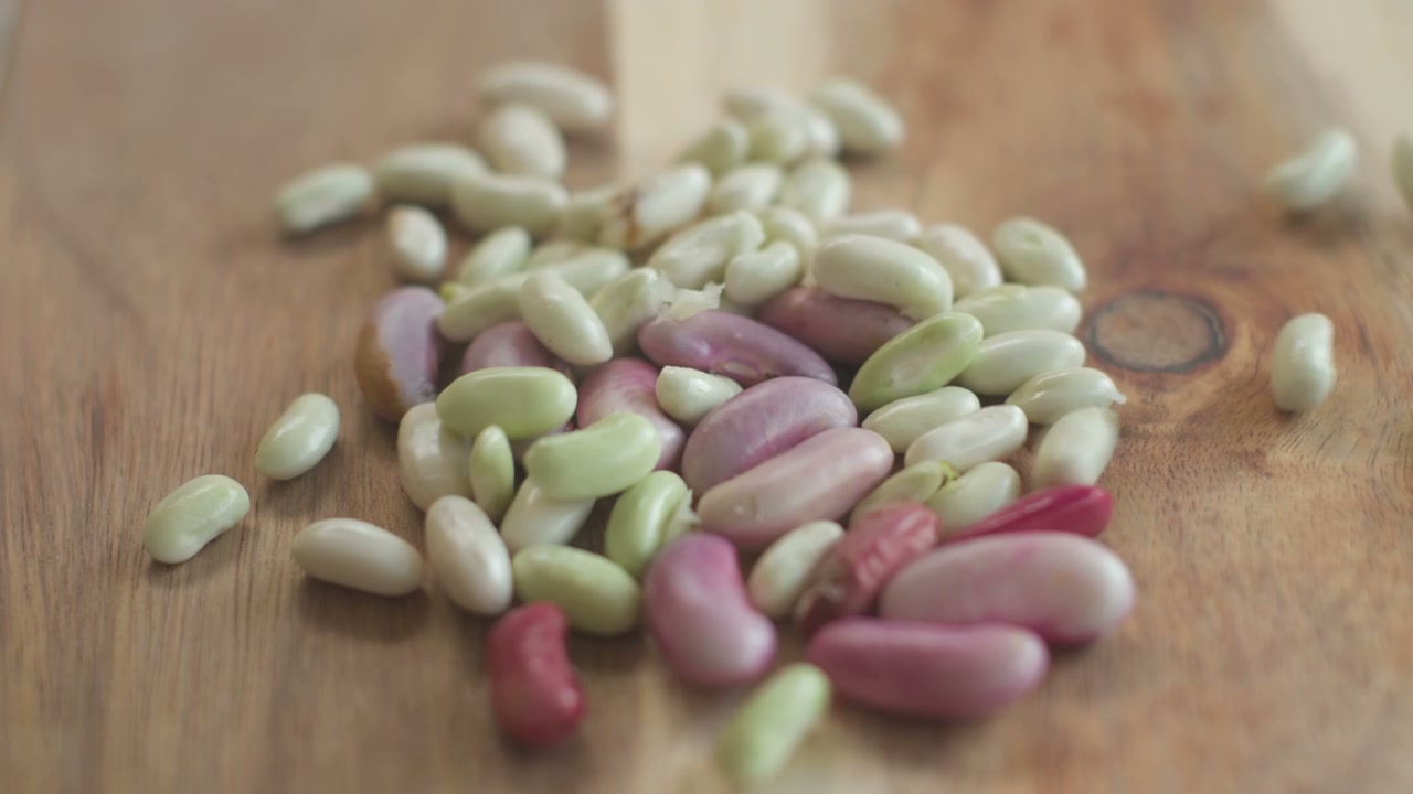 Homegrown Mixed Beans Falling on Wooden Board