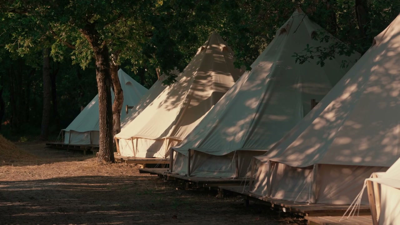 Glamping Bell Tents Lined Up at Campsite