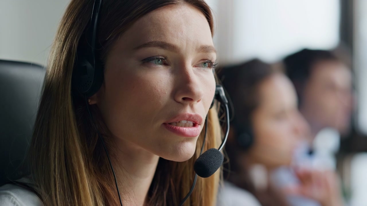 Focused Woman Talking in Headset at Call Center