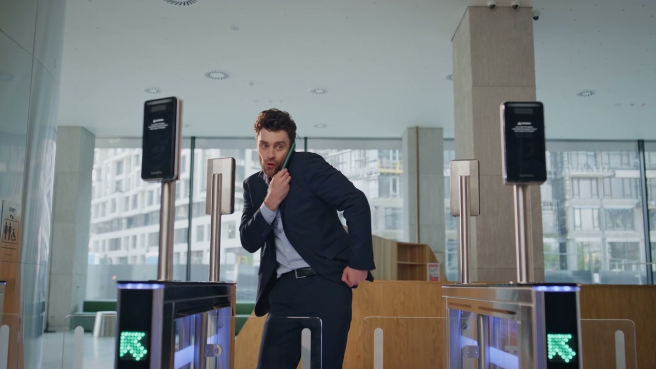 Businessman Swiping Access Card at Office Gate