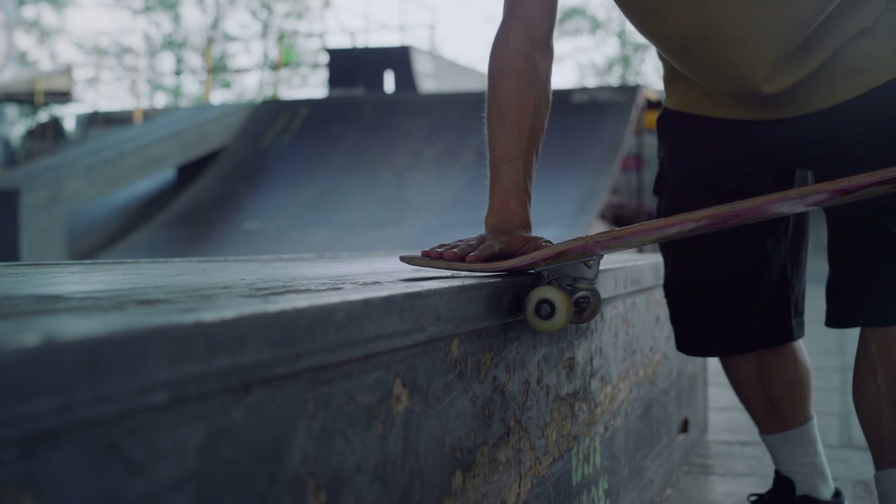 Close Up Skater Prepares Skateboard