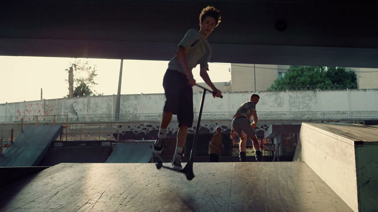 Young People Scooter and Rollerblade Tricks
