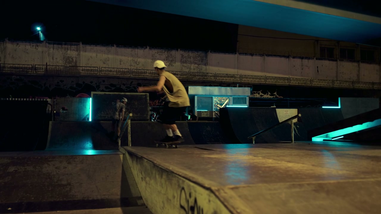 Skaters and Rollerblader at Night Skate Park