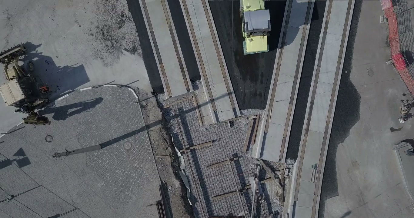 Road Roller Paving Asphalt on Tram Tracks
