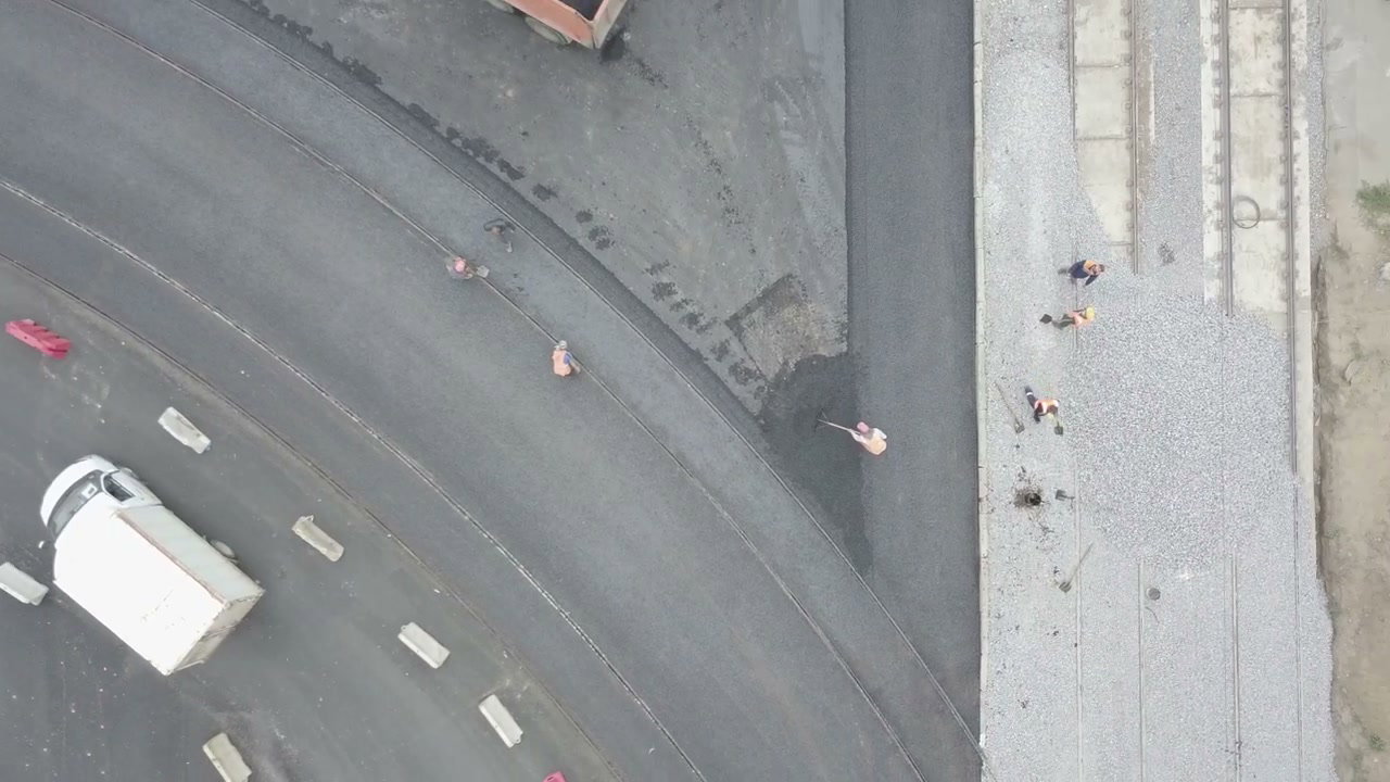 Road Construction Workers Paving Asphalt