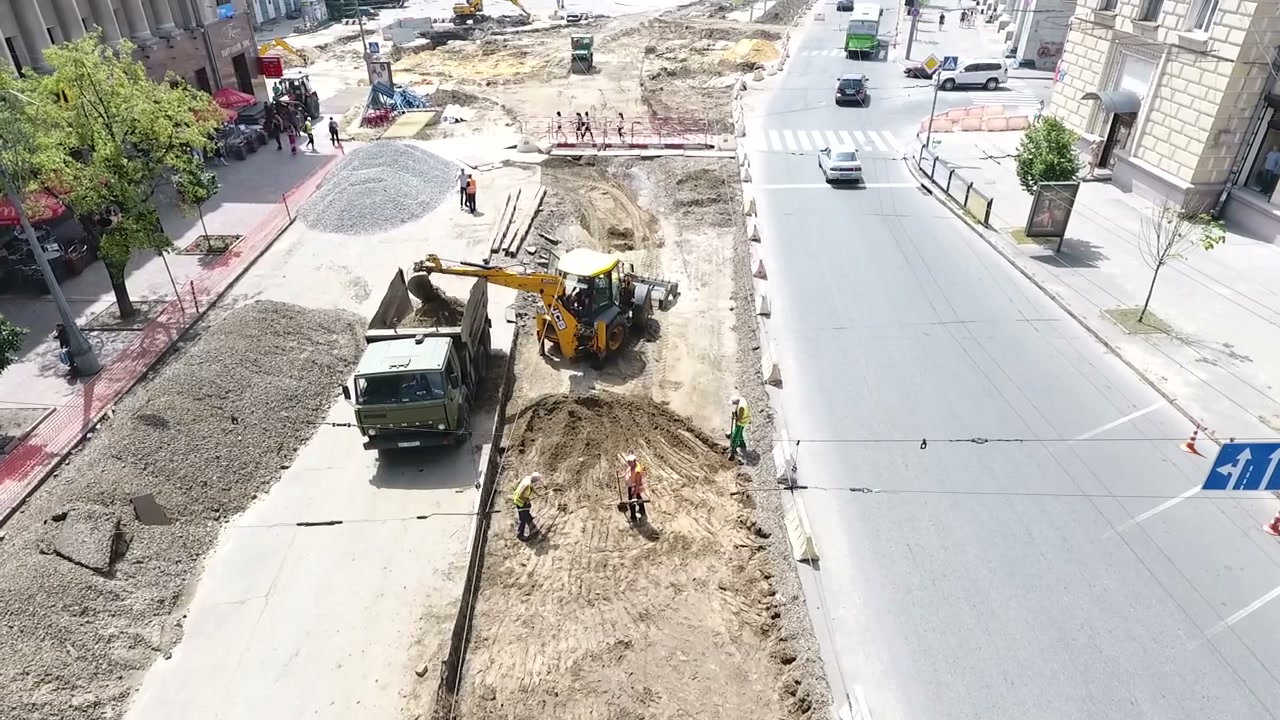 Road Construction with Excavator and Dump Truck
