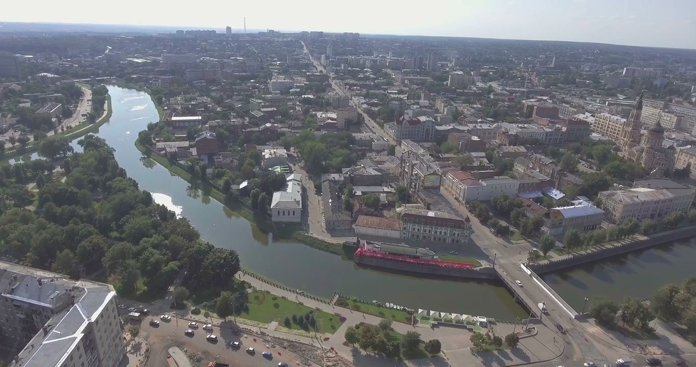 Aerial View of Cityscape with River and Bridge