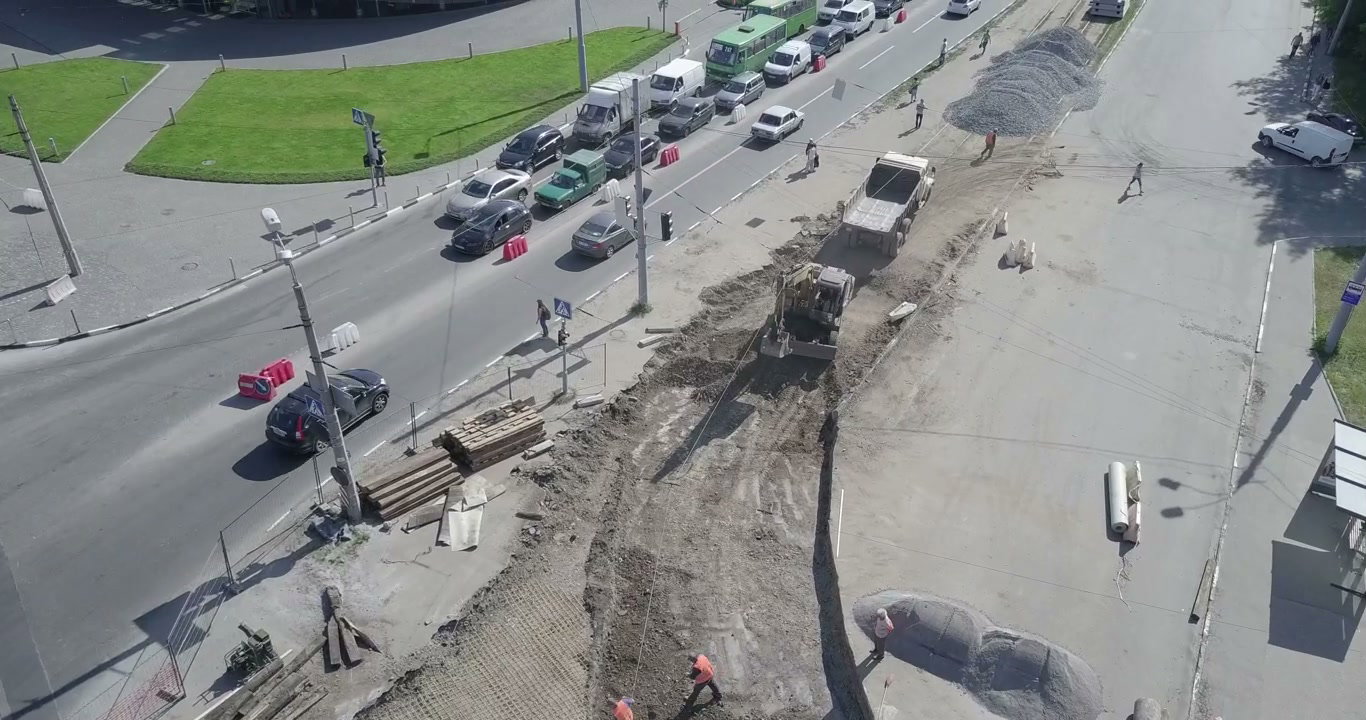 Aerial View of Road Construction and Urban Traffic