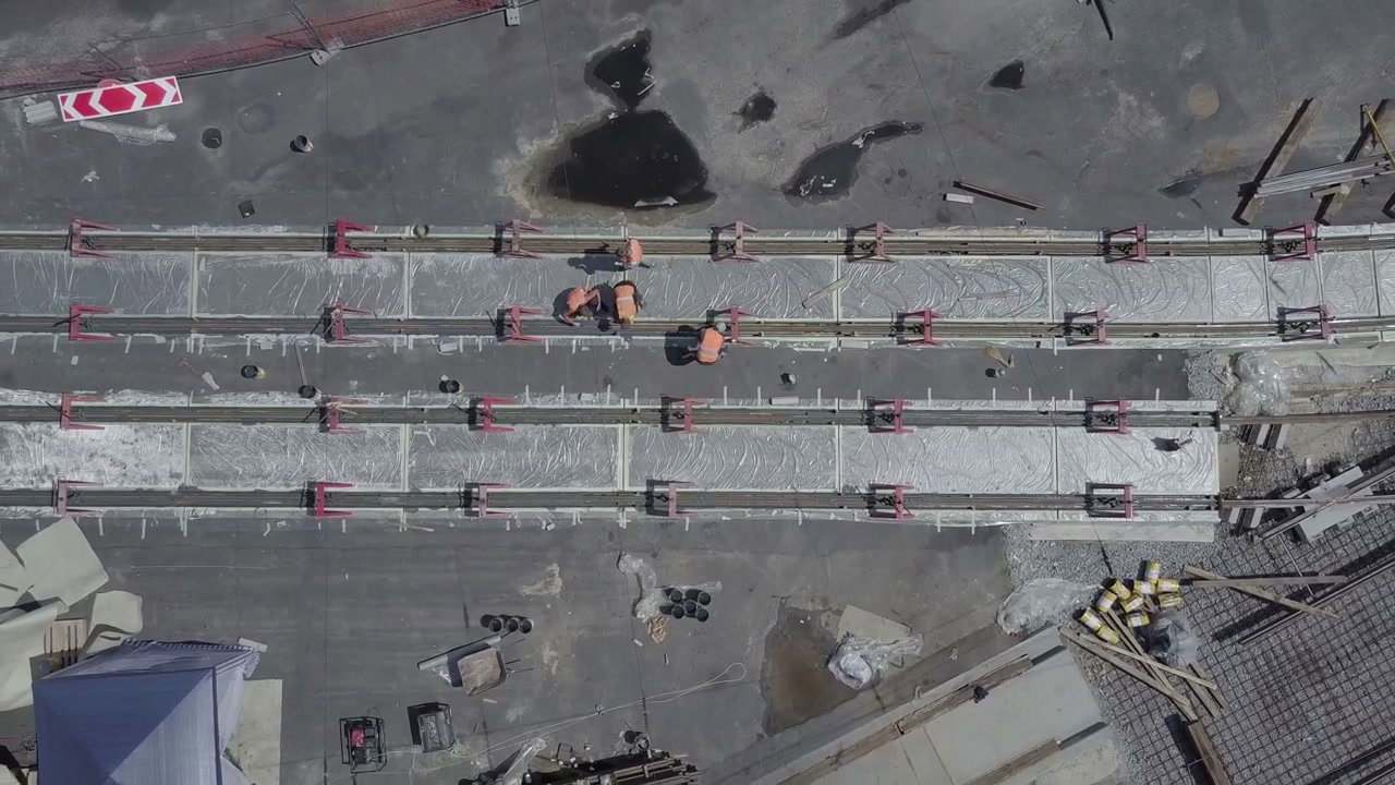 Aerial View of Construction Workers Laying Tram Tracks