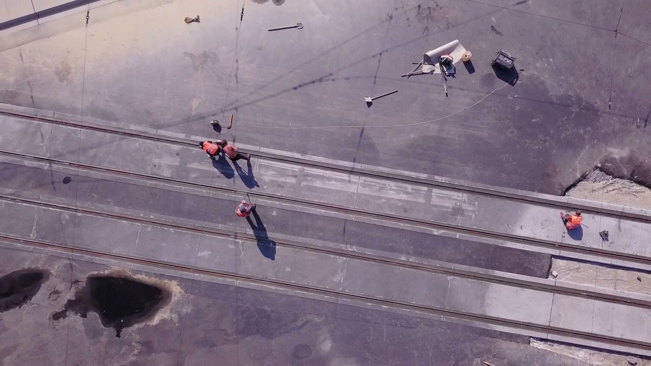 Construction Workers on Tram Tracks