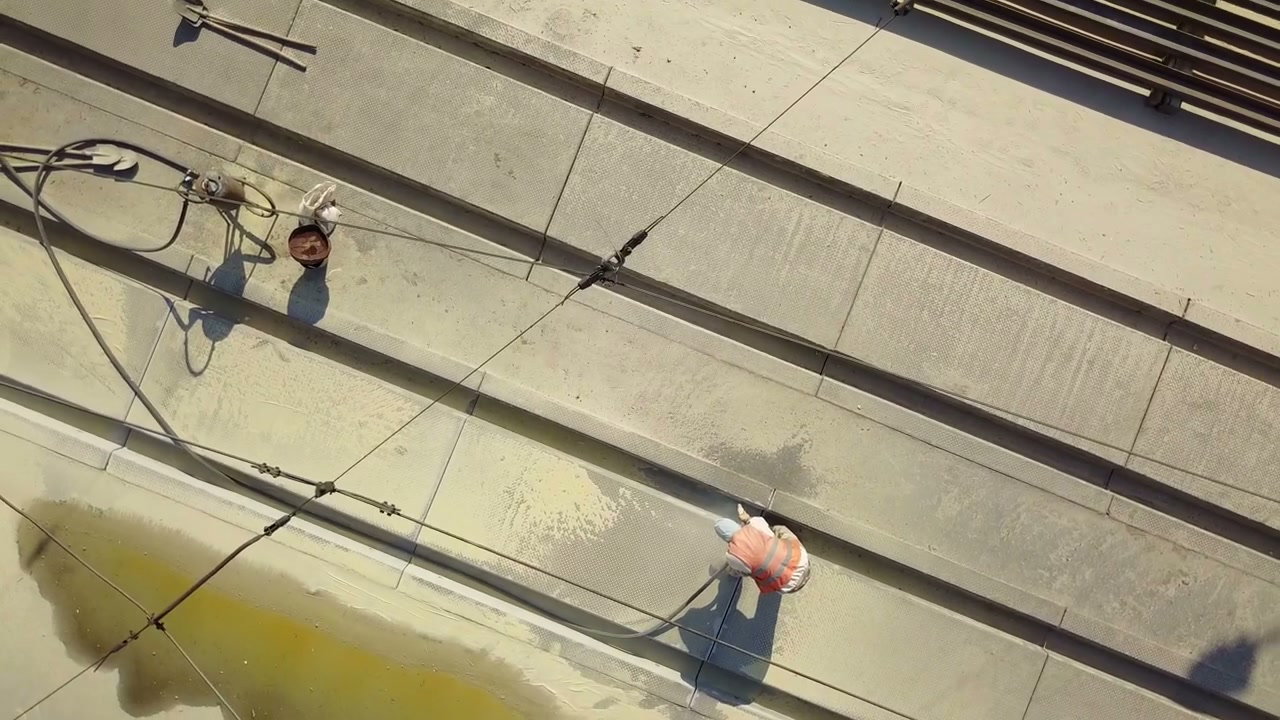 Construction Workers Cleaning Concrete Aerial View