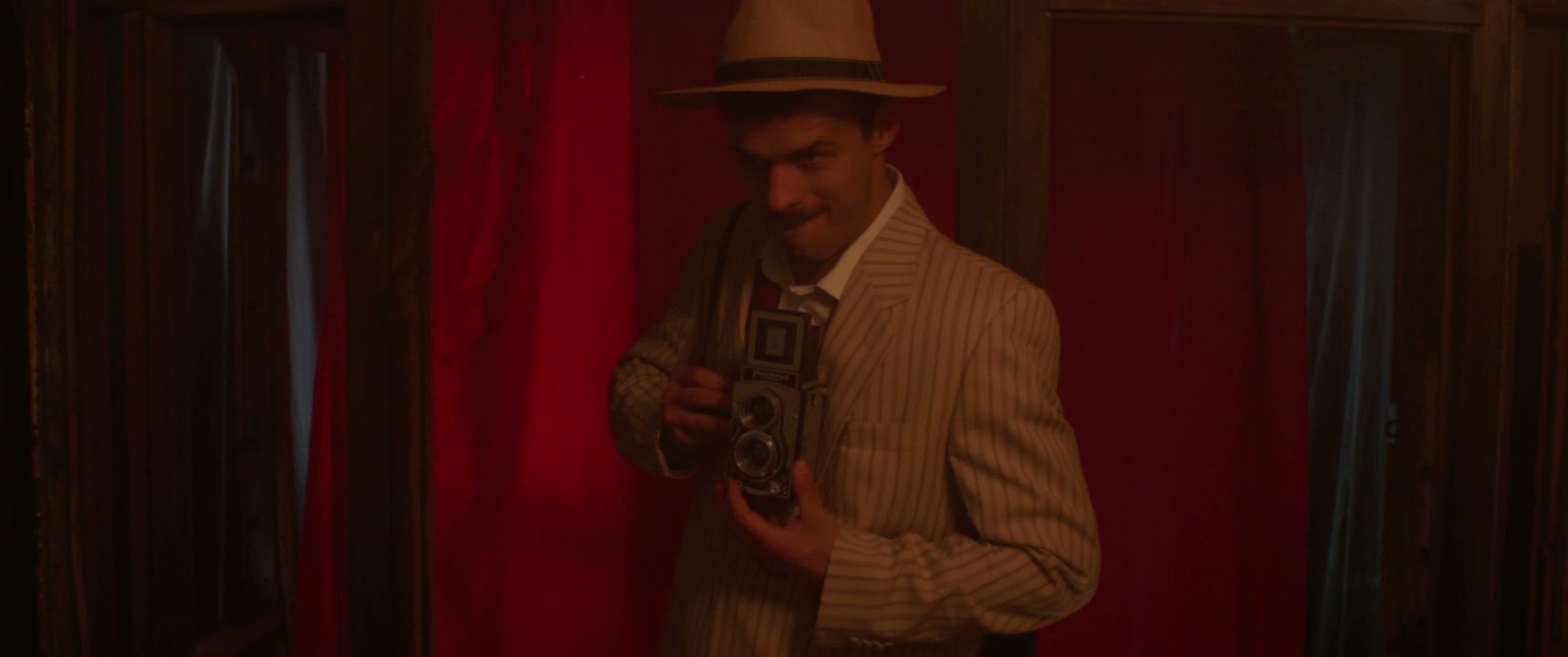 Retro Photographer Posing with Vintage Camera