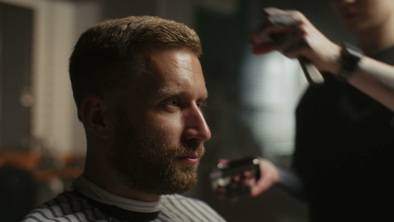 Man Getting Haircut in Barbershop