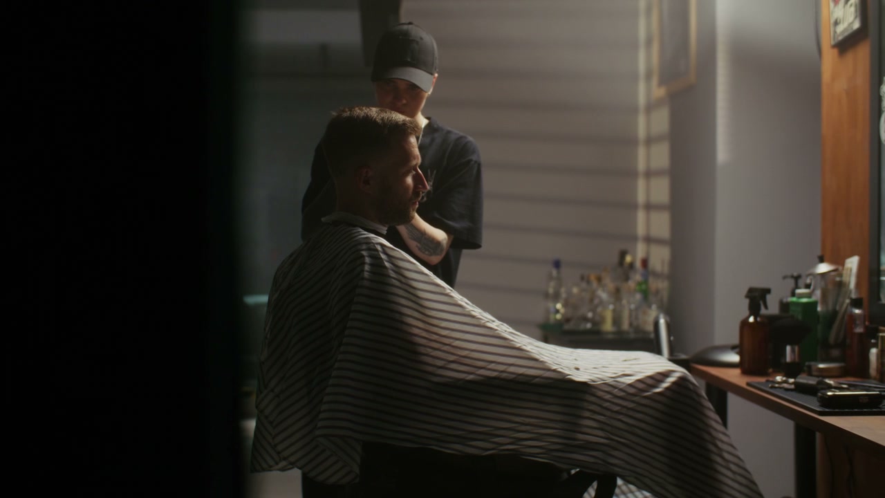 Barber Prepares Man for Haircut