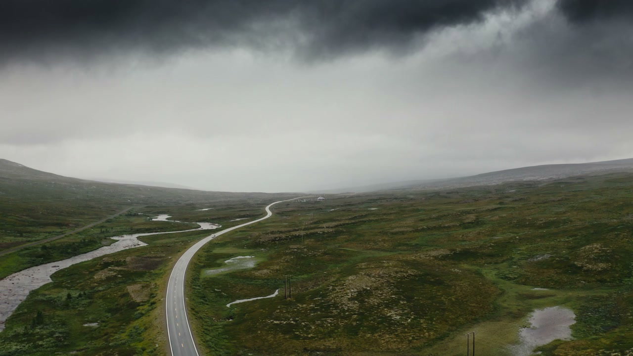 Remote Arctic Road Under Cloudy Sky