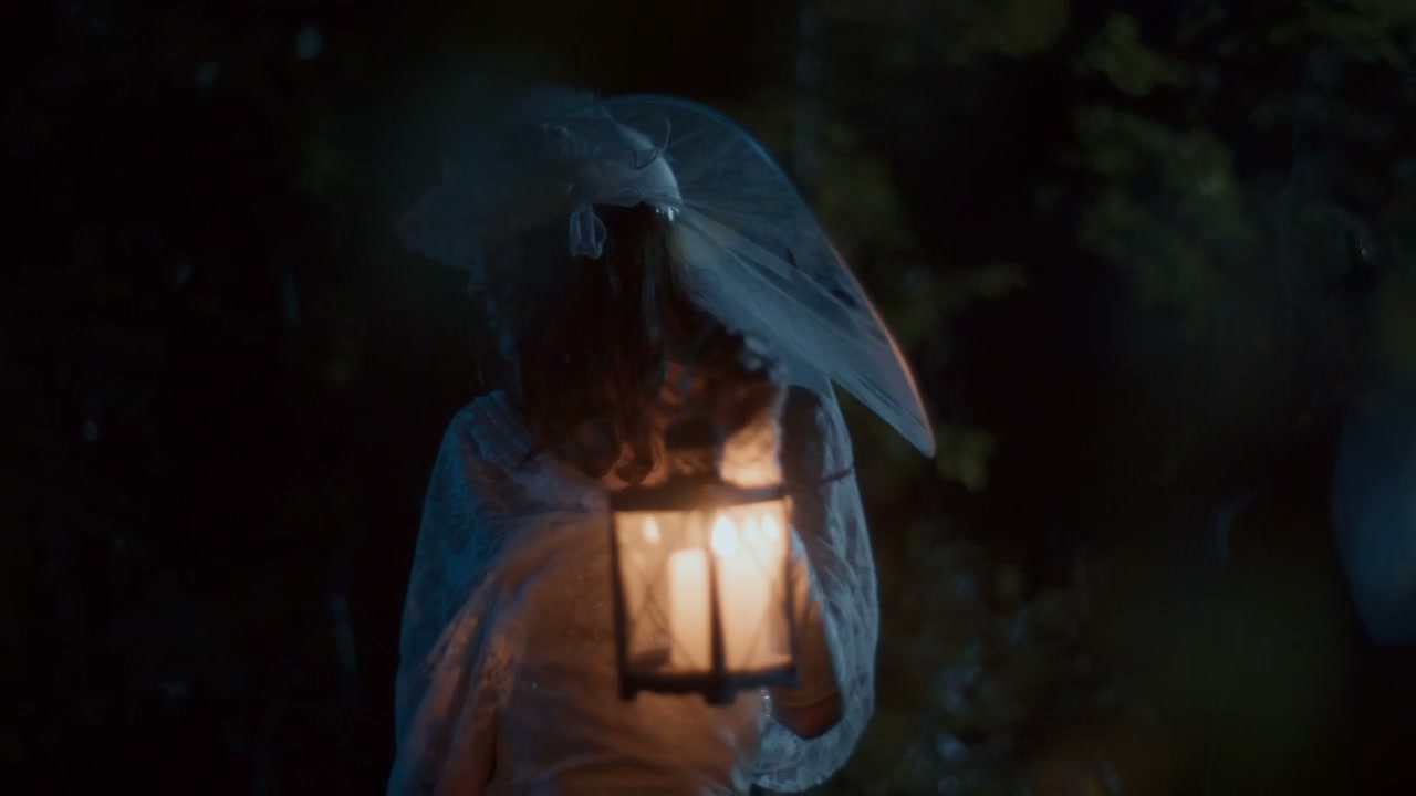 White Lady With Lantern in Dark Woods