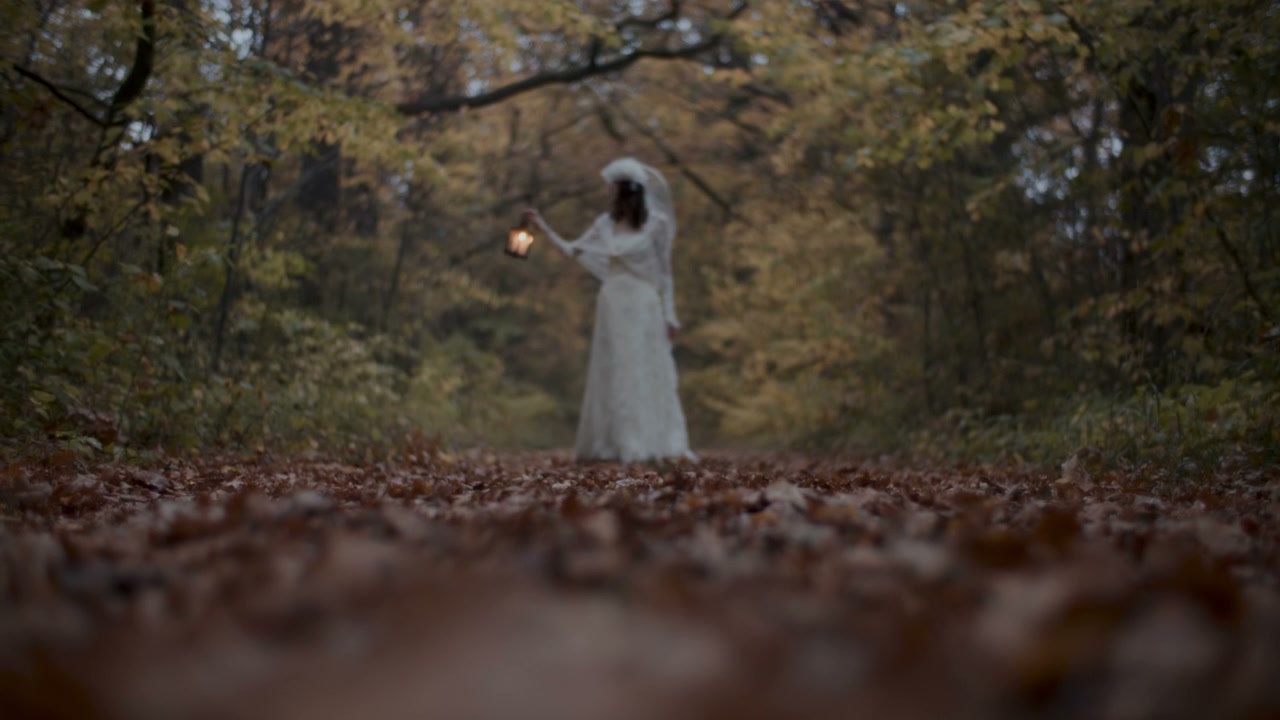 White Lady in Autumn Forest with Lantern