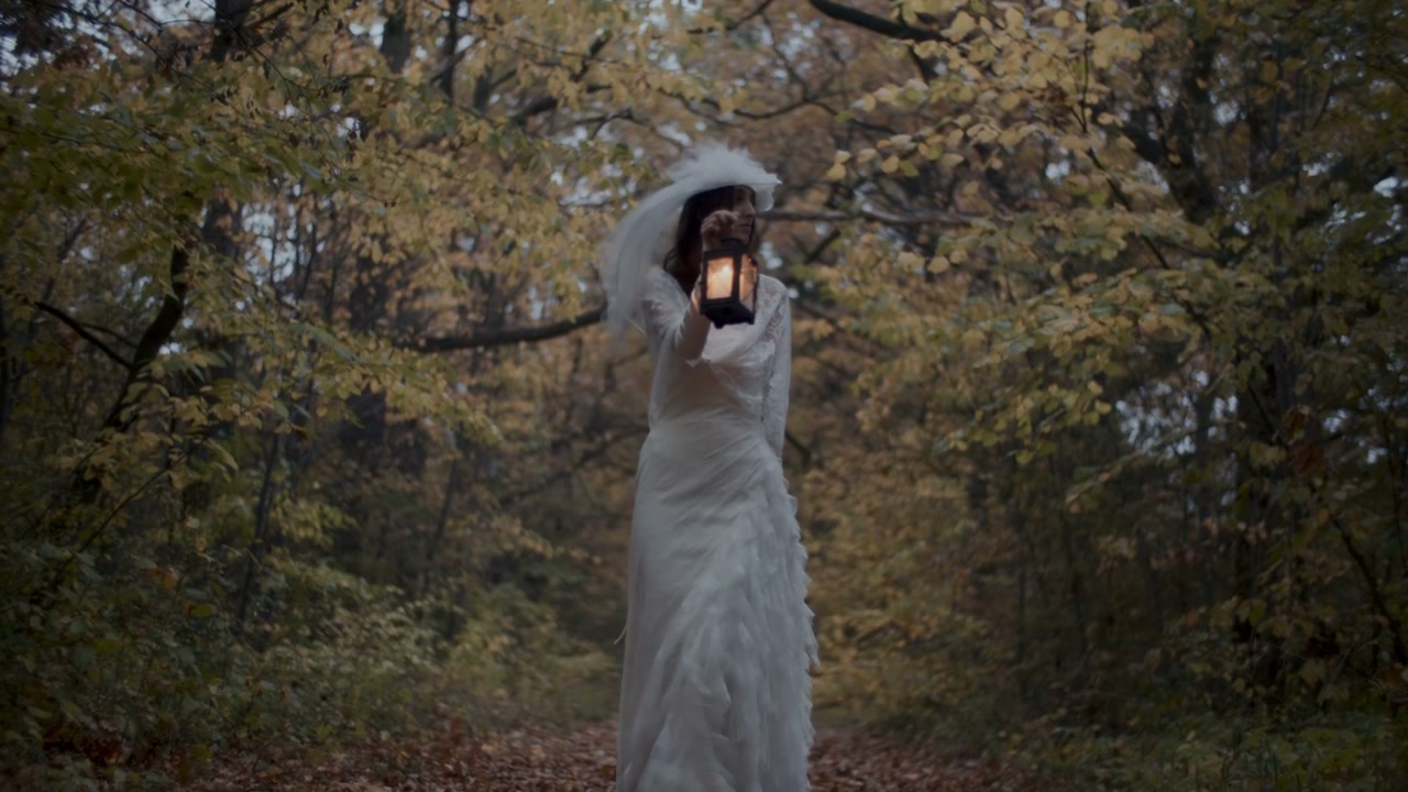 White Lady with Lantern in Autumn Woods