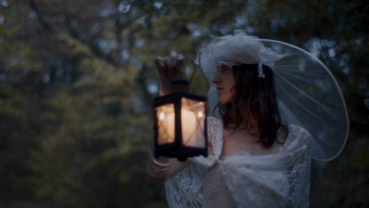 White Lady with Lantern in Dark Woods