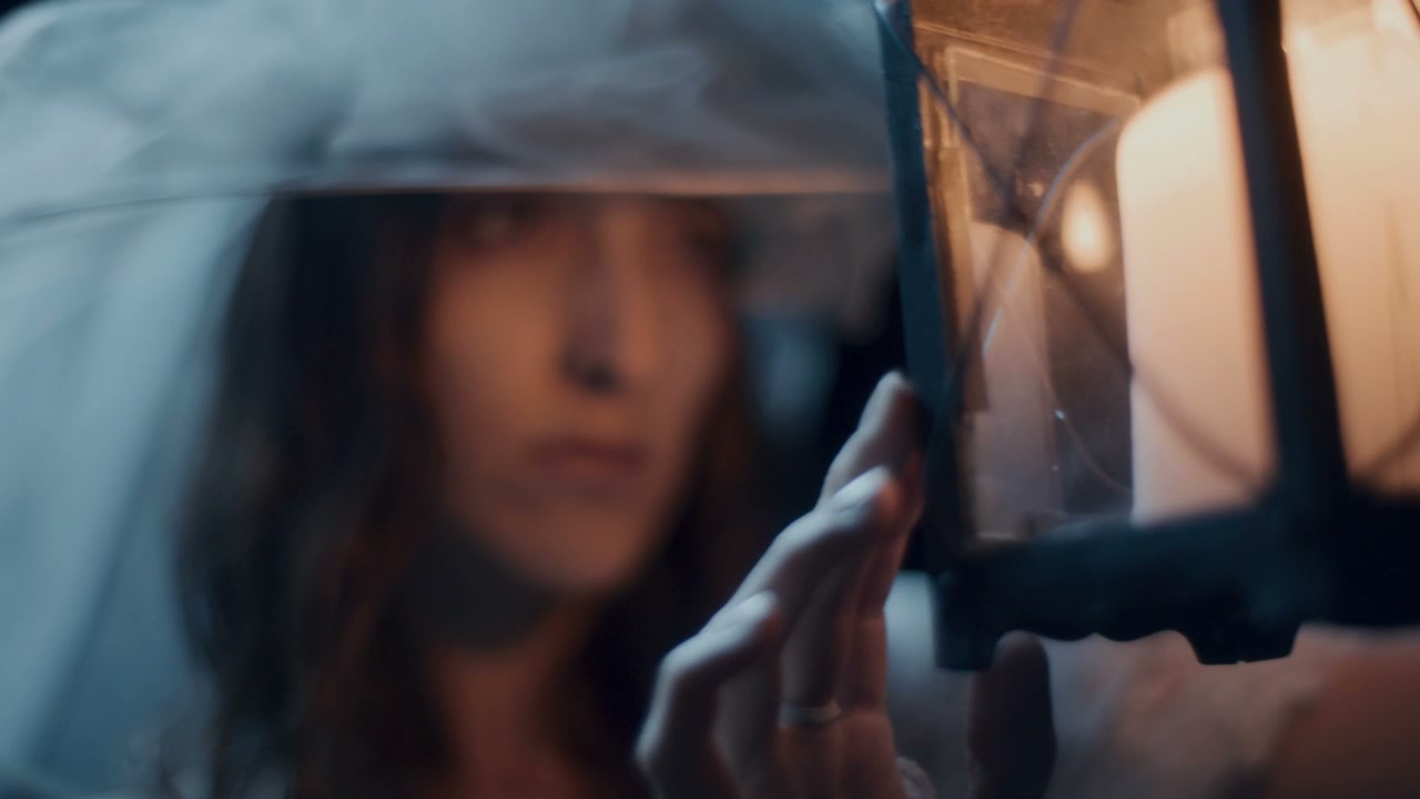 Pensive Woman Holding Lantern