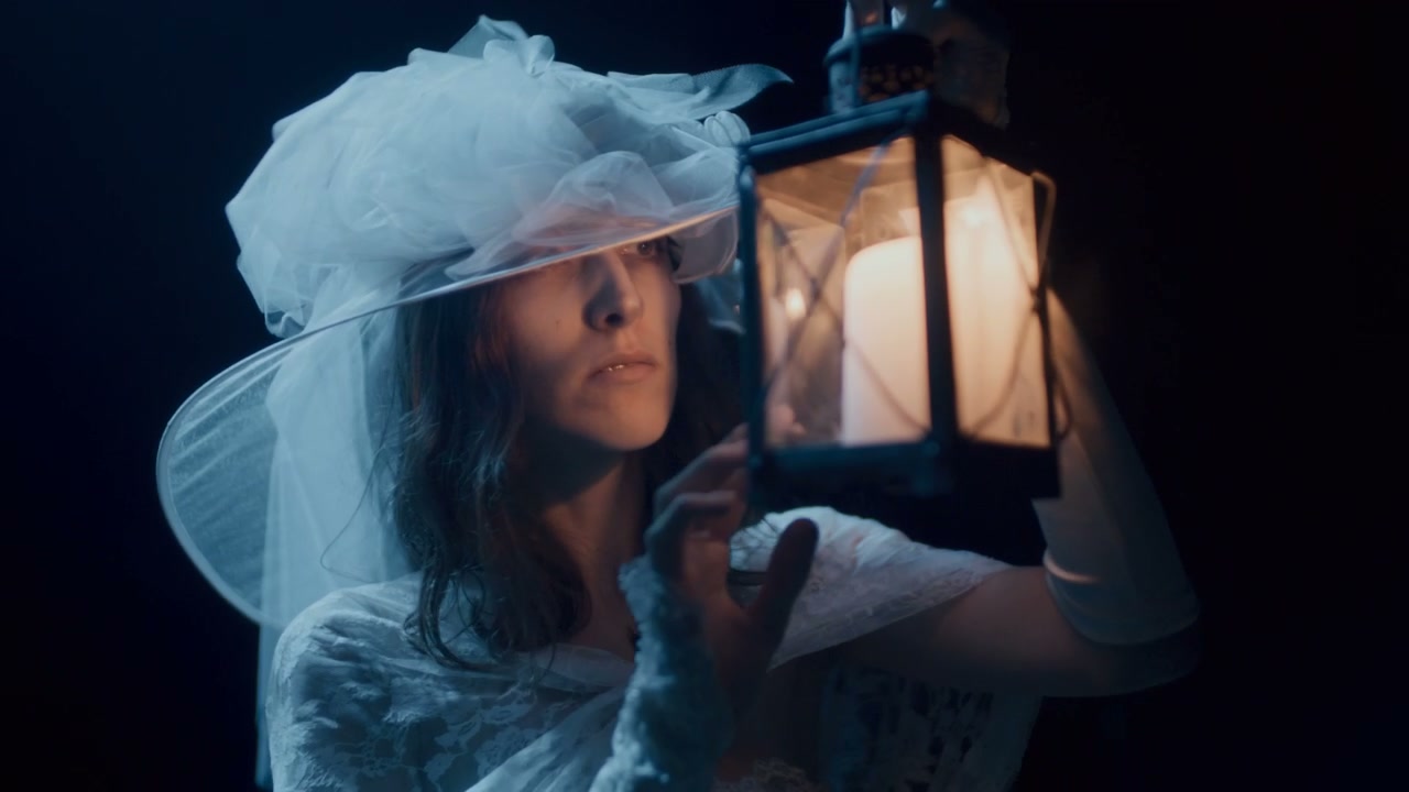 White Lady Holding Lantern