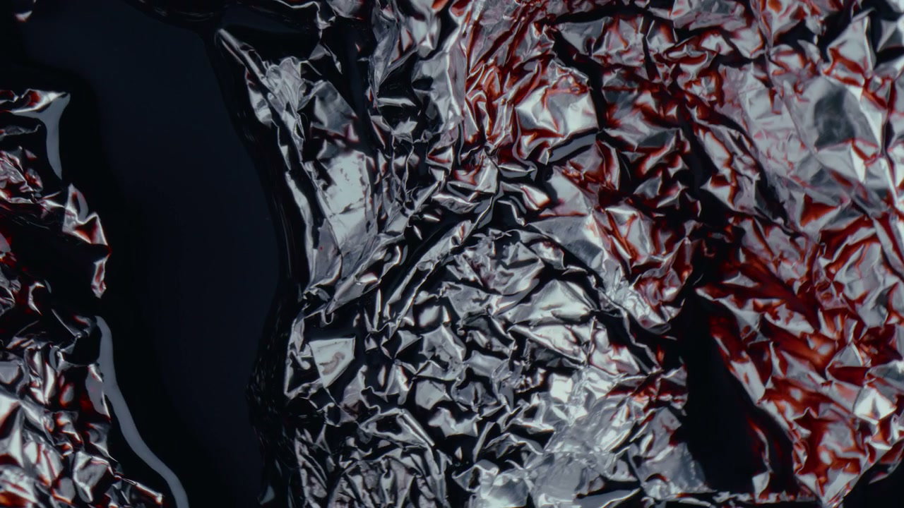 Abstract Red Liquid Flowing on Crumpled Foil