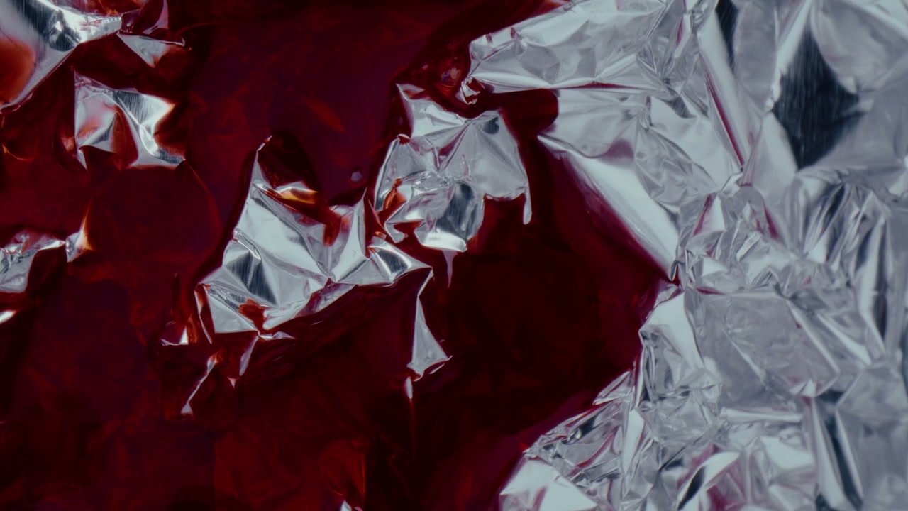 Abstract Red Liquid Flowing on Crumpled Foil