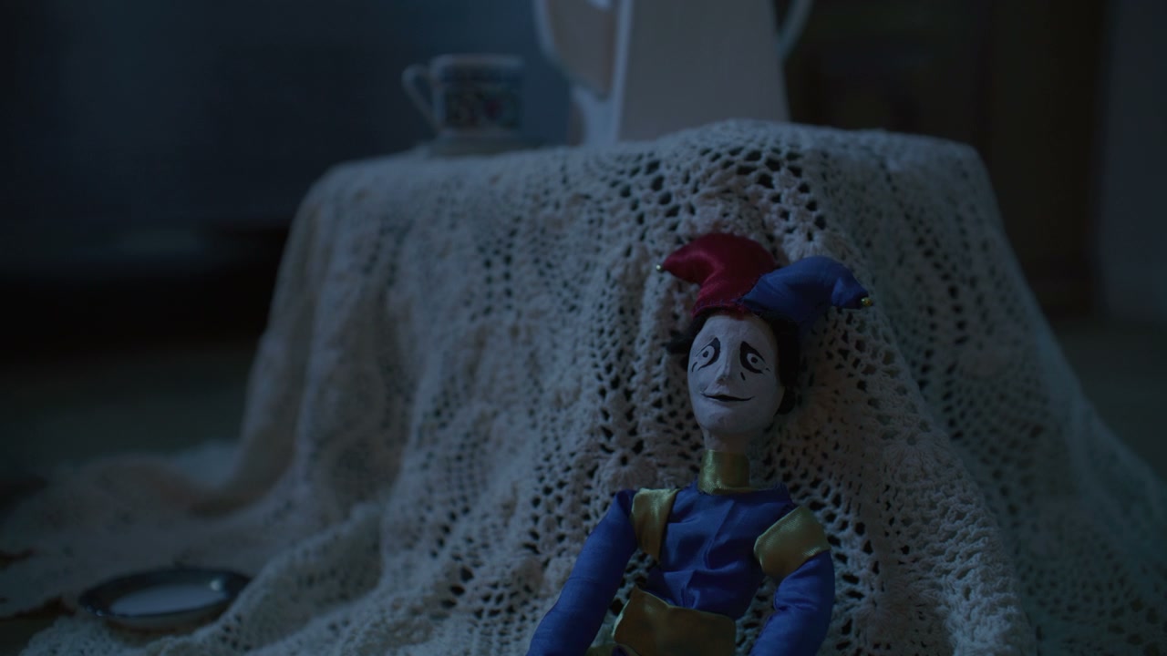 Creepy Jester Doll in a Dim Room