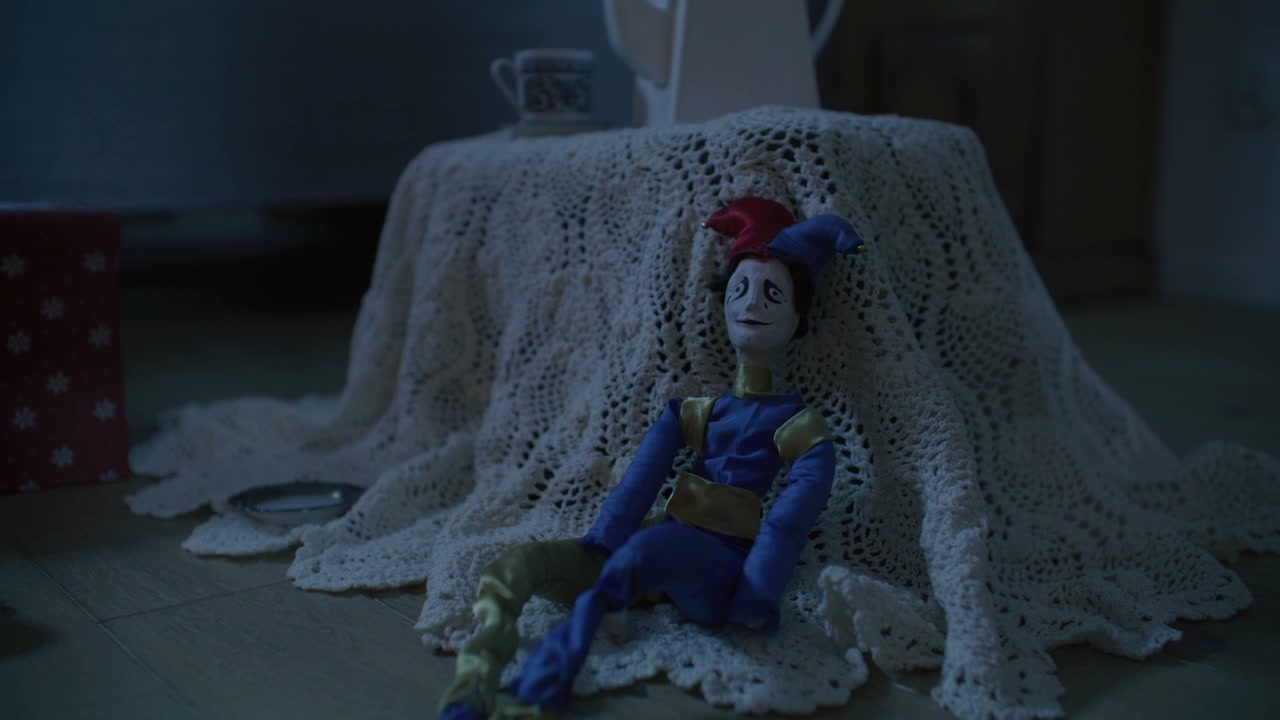 Creepy Jester Doll on Floor