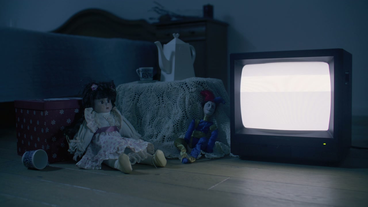 Dolls Watching Static on Old Television